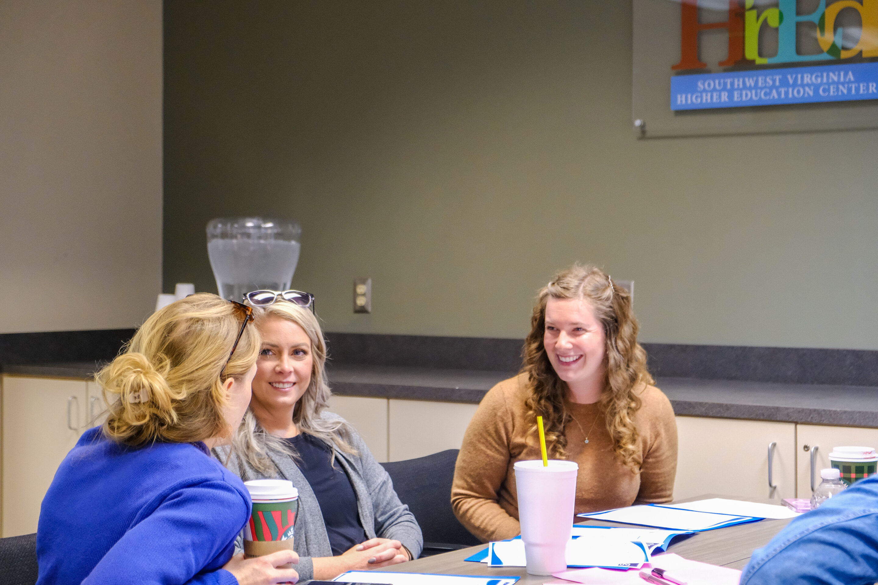 Room 240 includes u-shaped, tiered desks that can accommodate up to 65 participants.